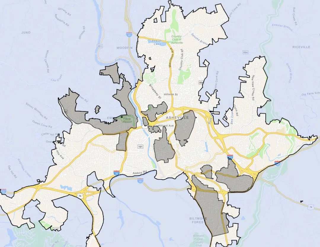 A map of Asheville with a handful or regions shaded gray.