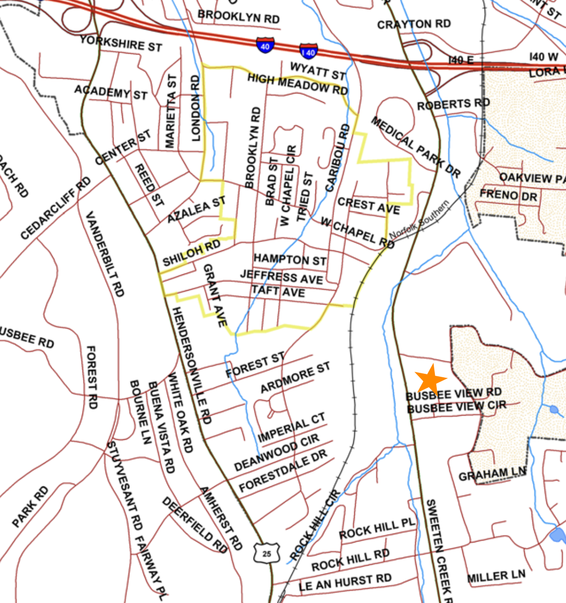 A map showing the boundaries of a neighborhood, with a star on the map to the southeast of that neighborhood.